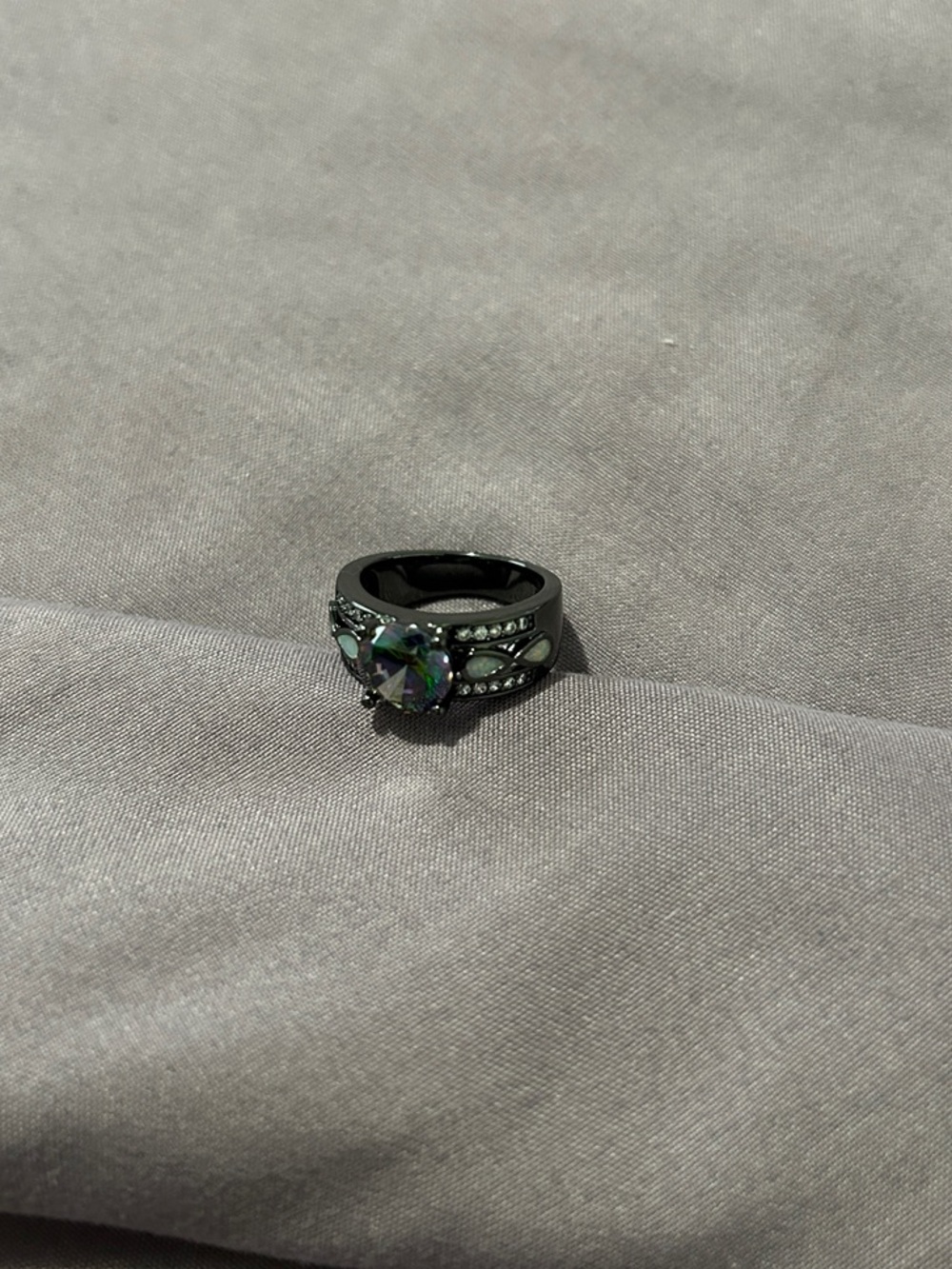 Black Ring with Iridescent Green Center Stone